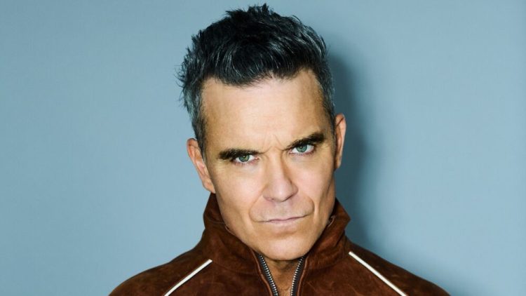 Membayar Utang Masa Lalu Robbie Williams Rebut Kembali Mahkota Britpop