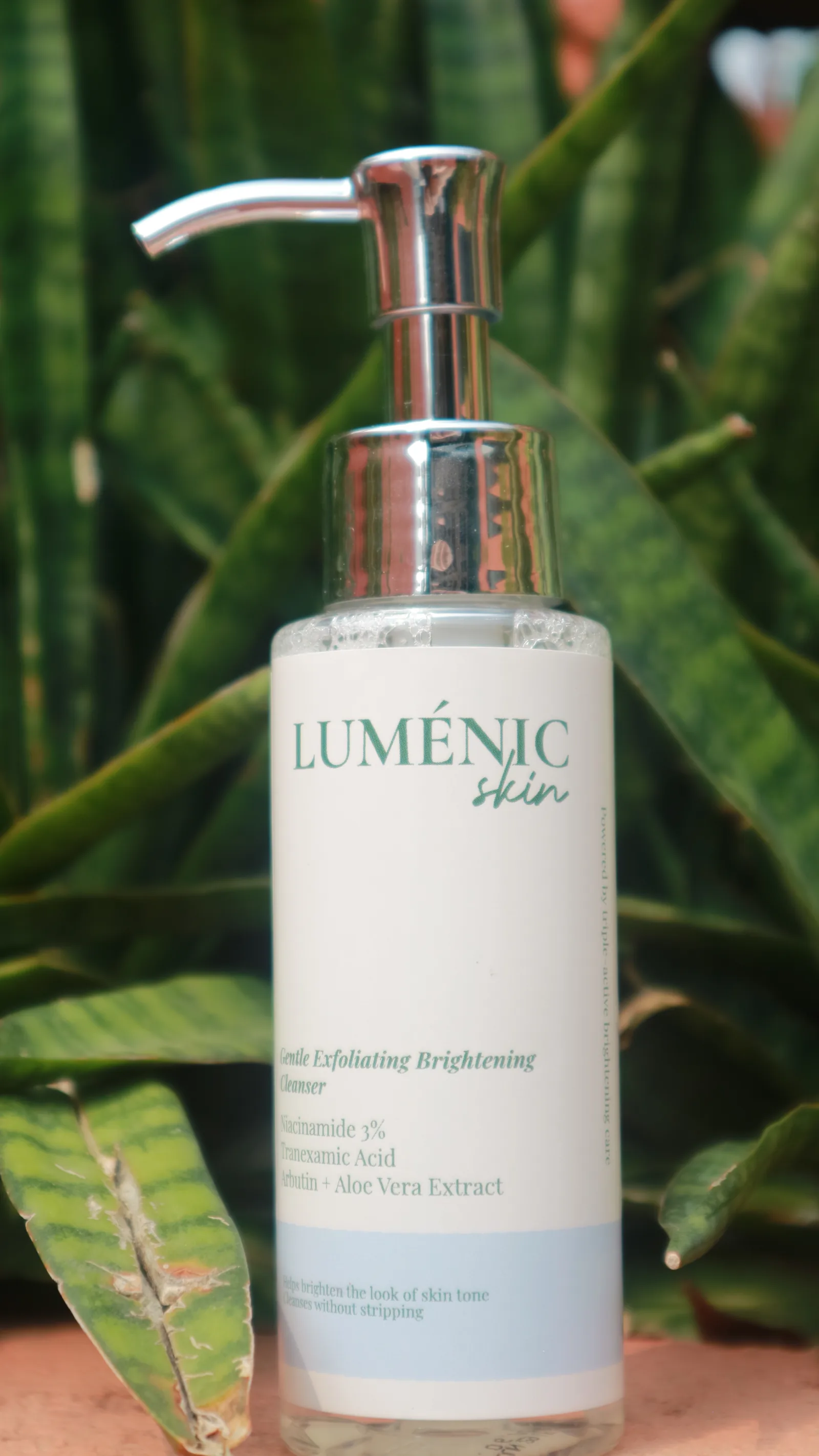Lumenic Skin cleanser among green foliage